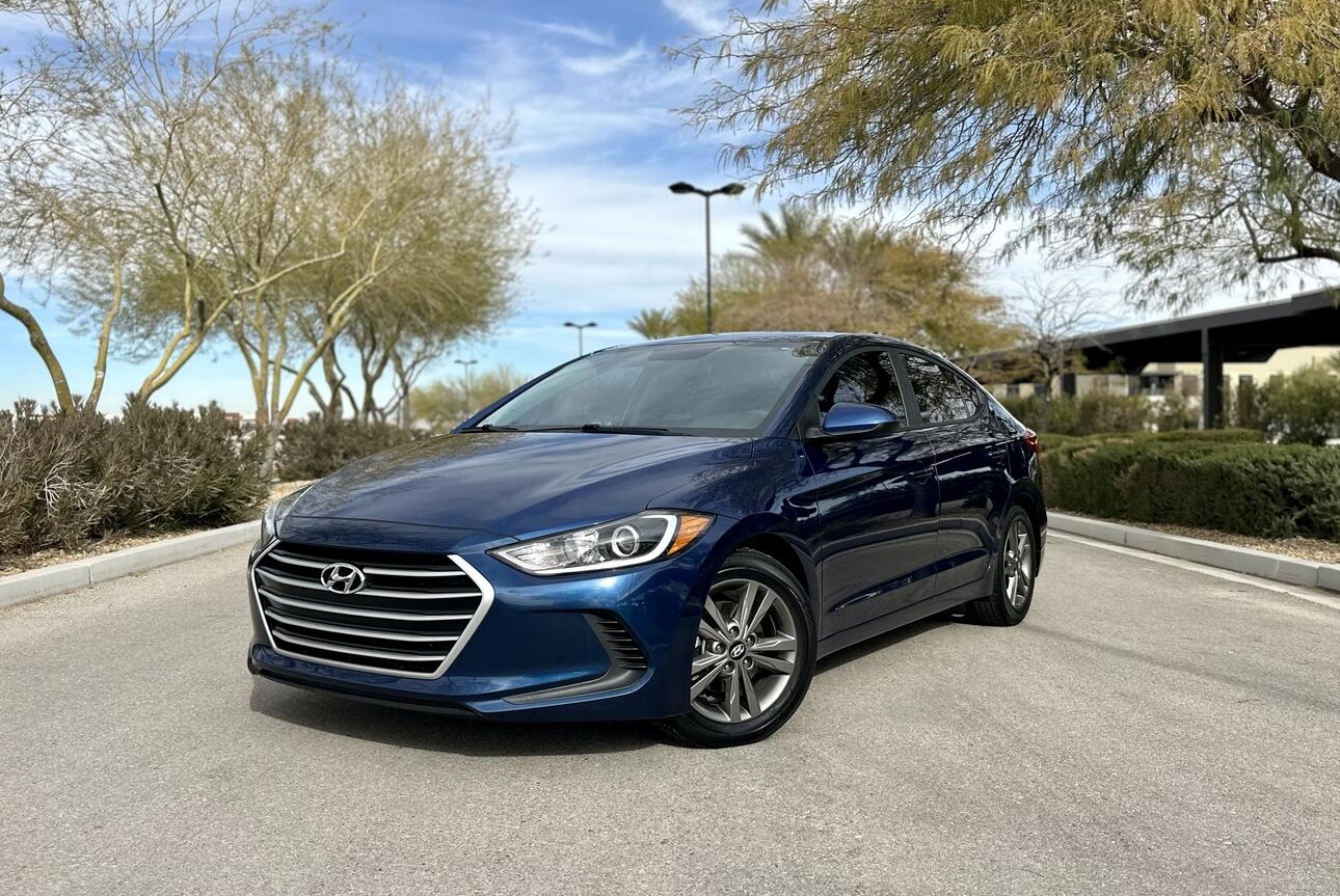 blue color car standing on the road